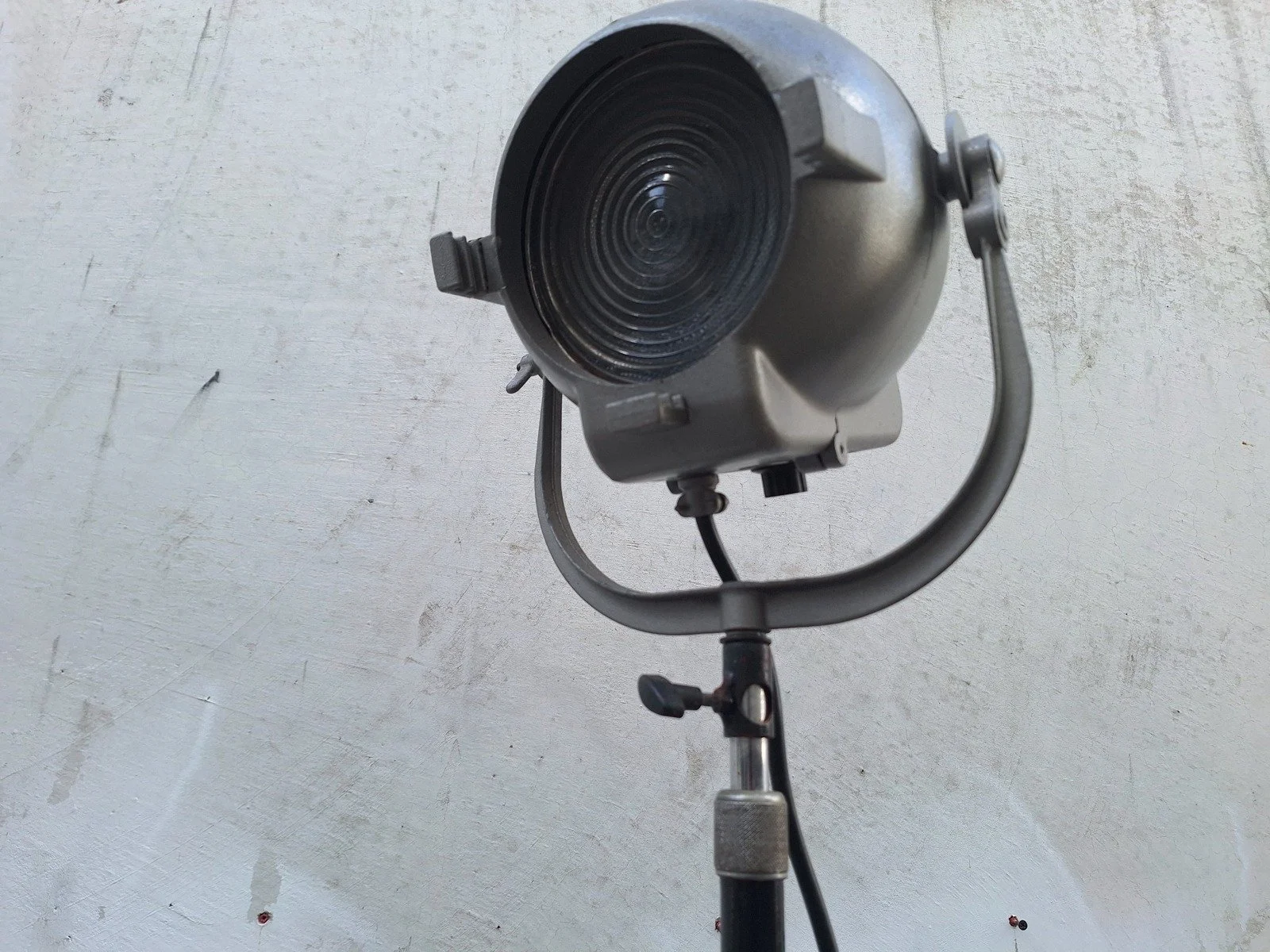 Close view of lamp No. 2 showing the ridged glass lens, supporting yoke and adjustment knobs.