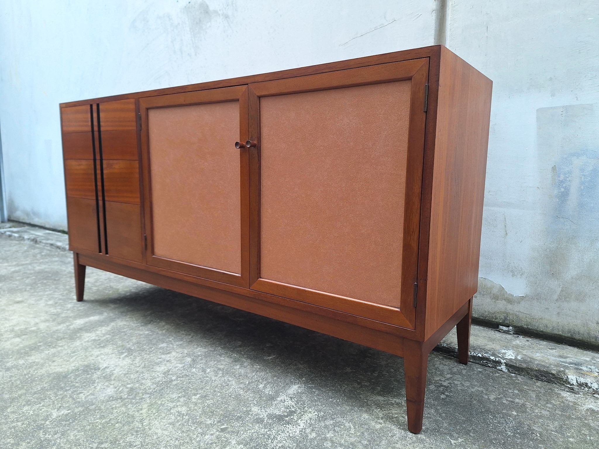 Professionally restored mid century timber sideboard with four drawers, tan vinyl inlay cabinet doors and adjustable shelving.