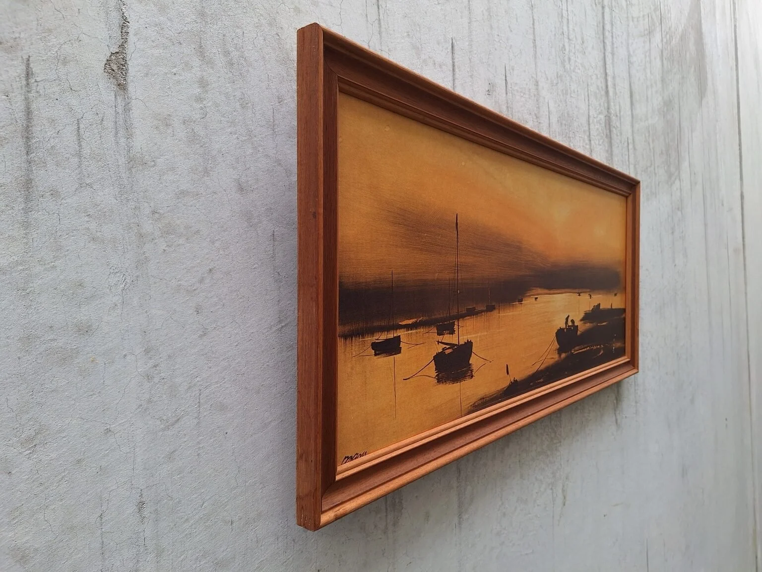 Side view showing the depth of the timber frame and the harbour print mounted against the wall.