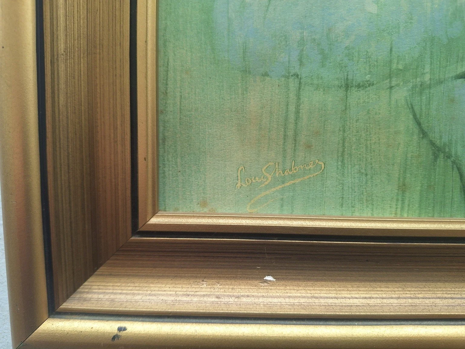 Reproduced Louis Shabner signature at lower left and chips to the gold-tone frame.