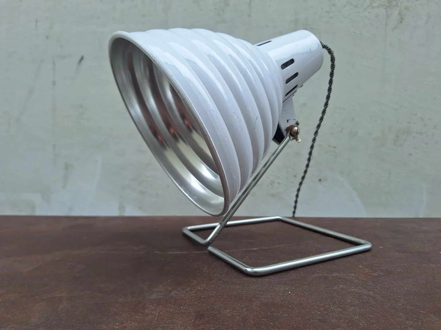 Pifco lamp from the front side showing reflector and angled shade.