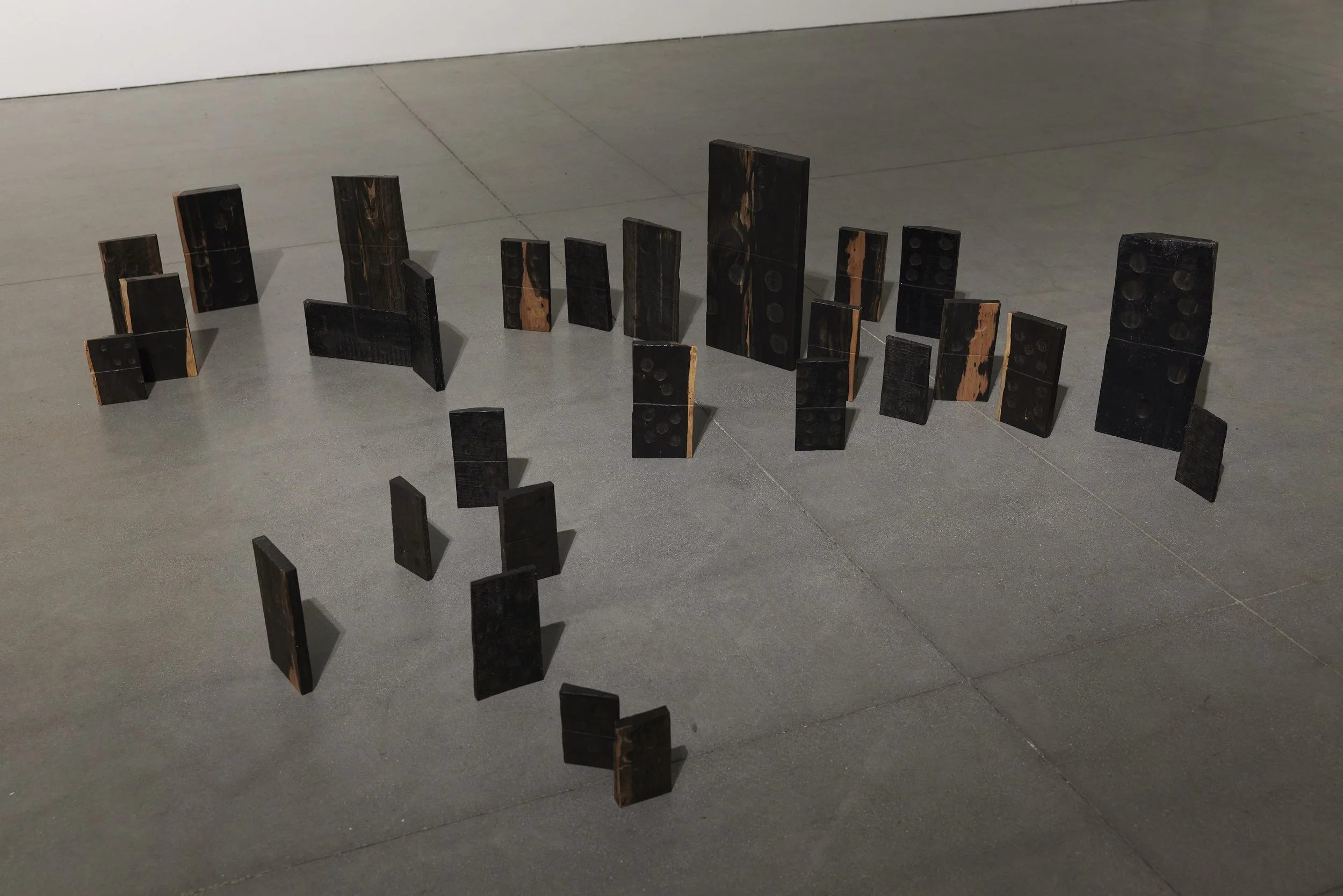 Zenobia Lee "Poiesis," 2025 Hand carved ebony wood, 28 pieces, dimensions variable 