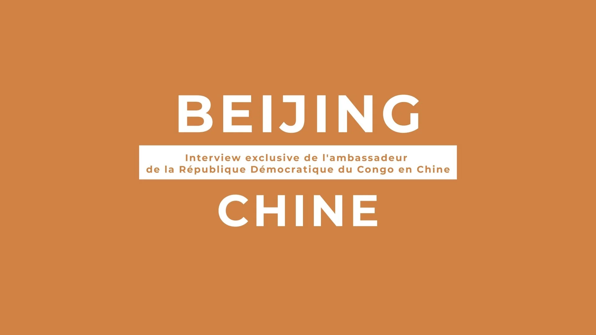 Cover page of a publication with an orange background, featuring the words 'BEIJING' and 'CHINA' in large white letters, and a white rectangle in the middle with smaller text in French about an exclusive interview with the ambassador of the Democrati