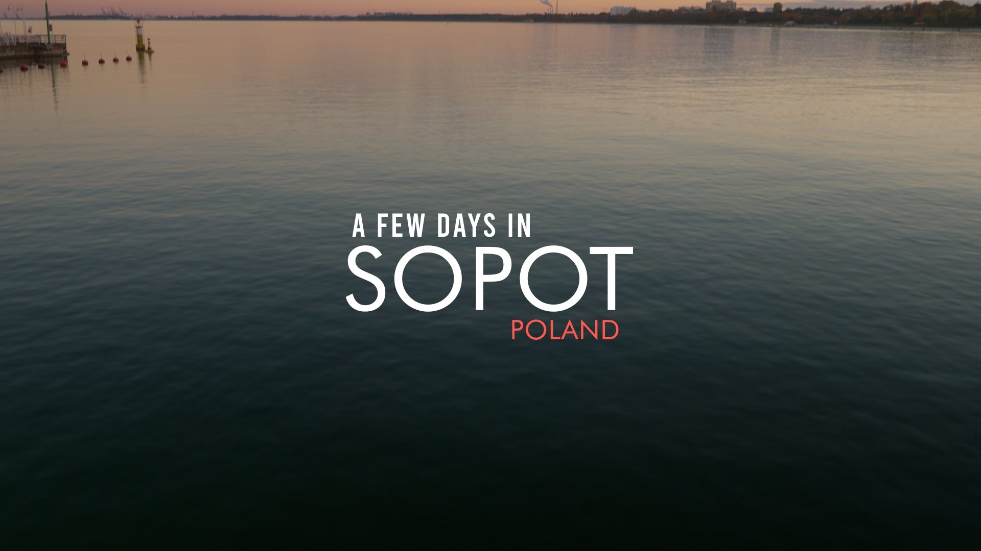 Calm river during sunset in Poland with the text 'A Few Days in Sopot Poland' overlayed.