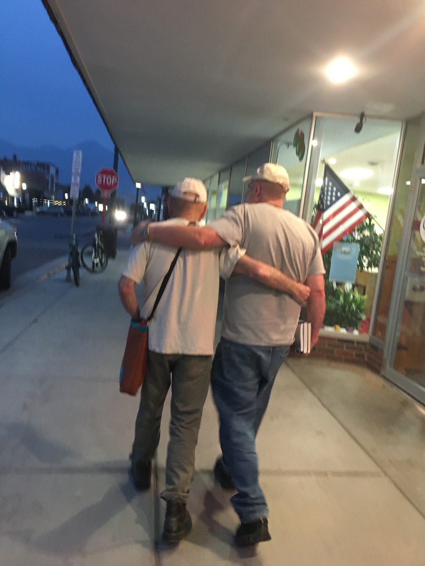 Doug Peacock and Roderick MacIver walking down the street in Livingston, Montana