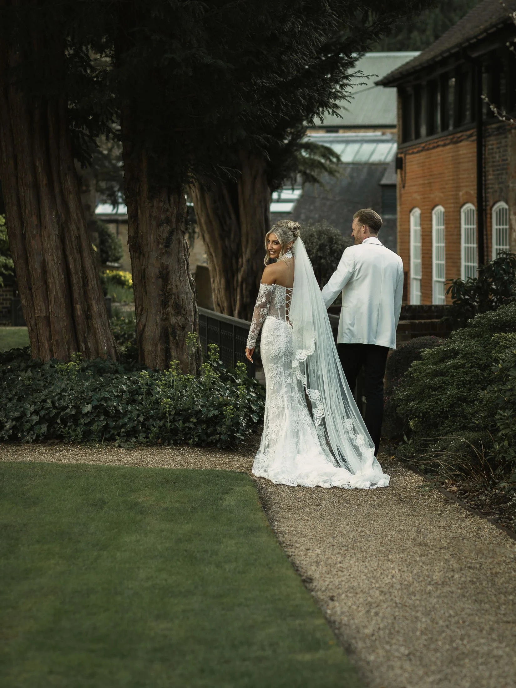 A couples portrait session in the formal gardens of The Orangery Maidstone in Kent.