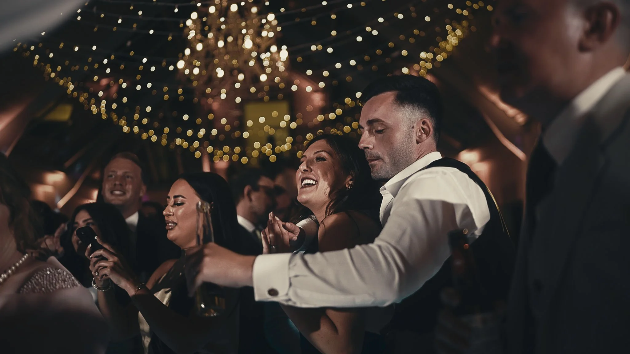 Evening reception atmosphere in the Botleys Mansion Atrium as lighting softens and the room becomes a party space.