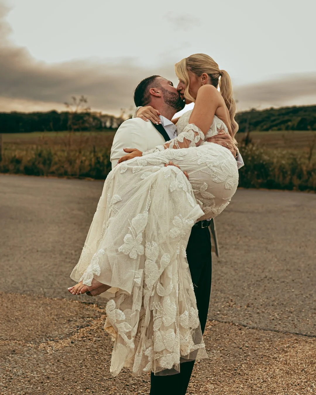 A couples portrait during sunset on their wedding day, captured by a Kent photography and videography team.