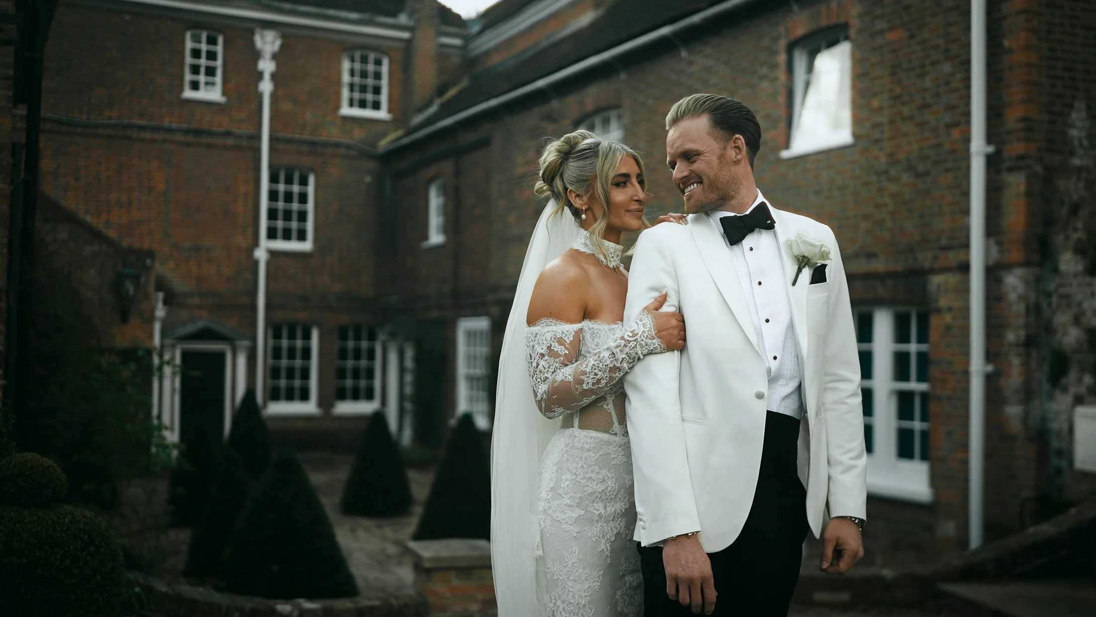 An editorial-style couple portrait taken from a cinematic storytelling wedding film captured at The Orangery Maidstone, UK.