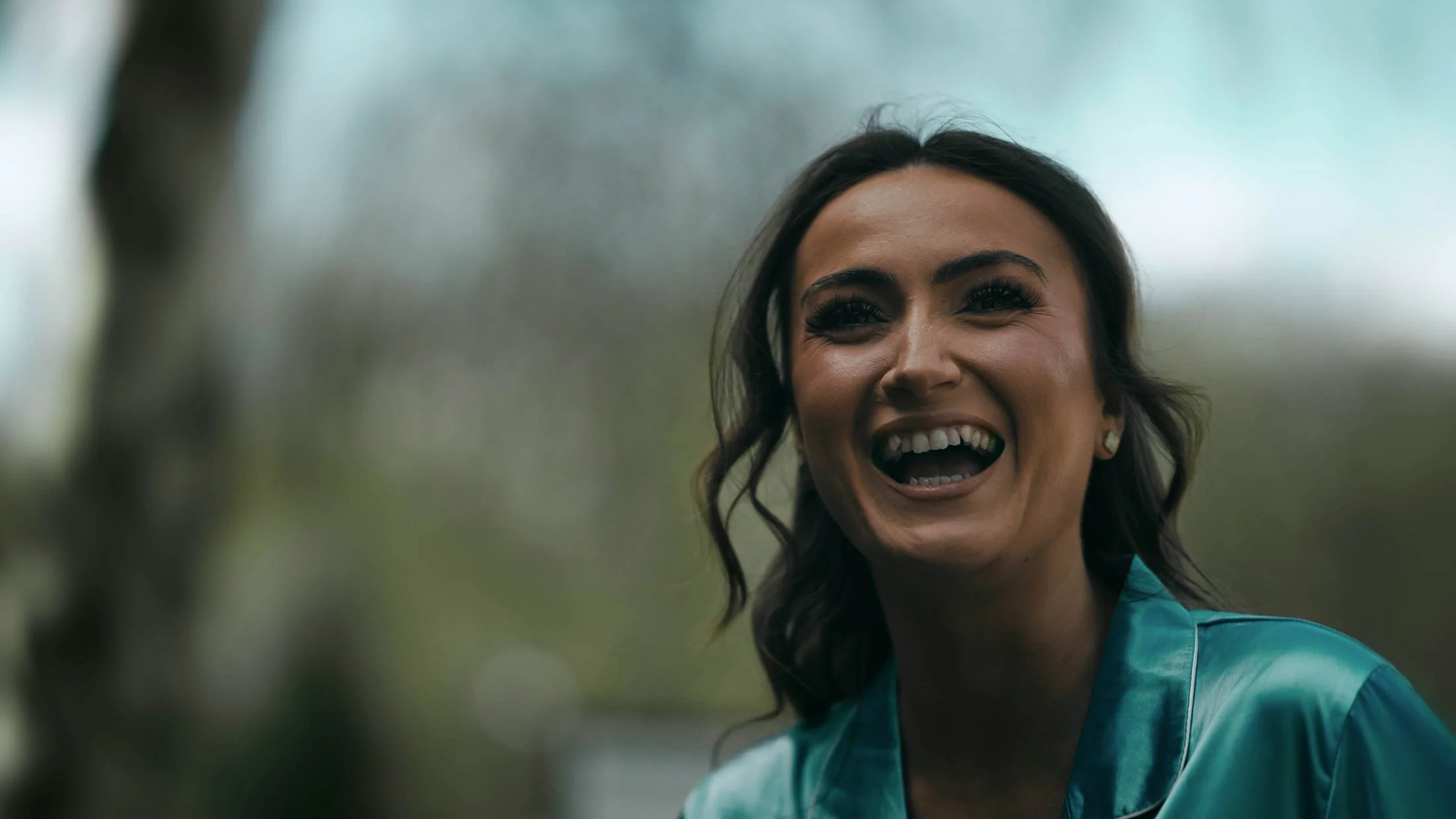 The Maid of Honour gives an interview to camera during the wedding day, as part of the narrative for a storytelling wedding film in the UK.