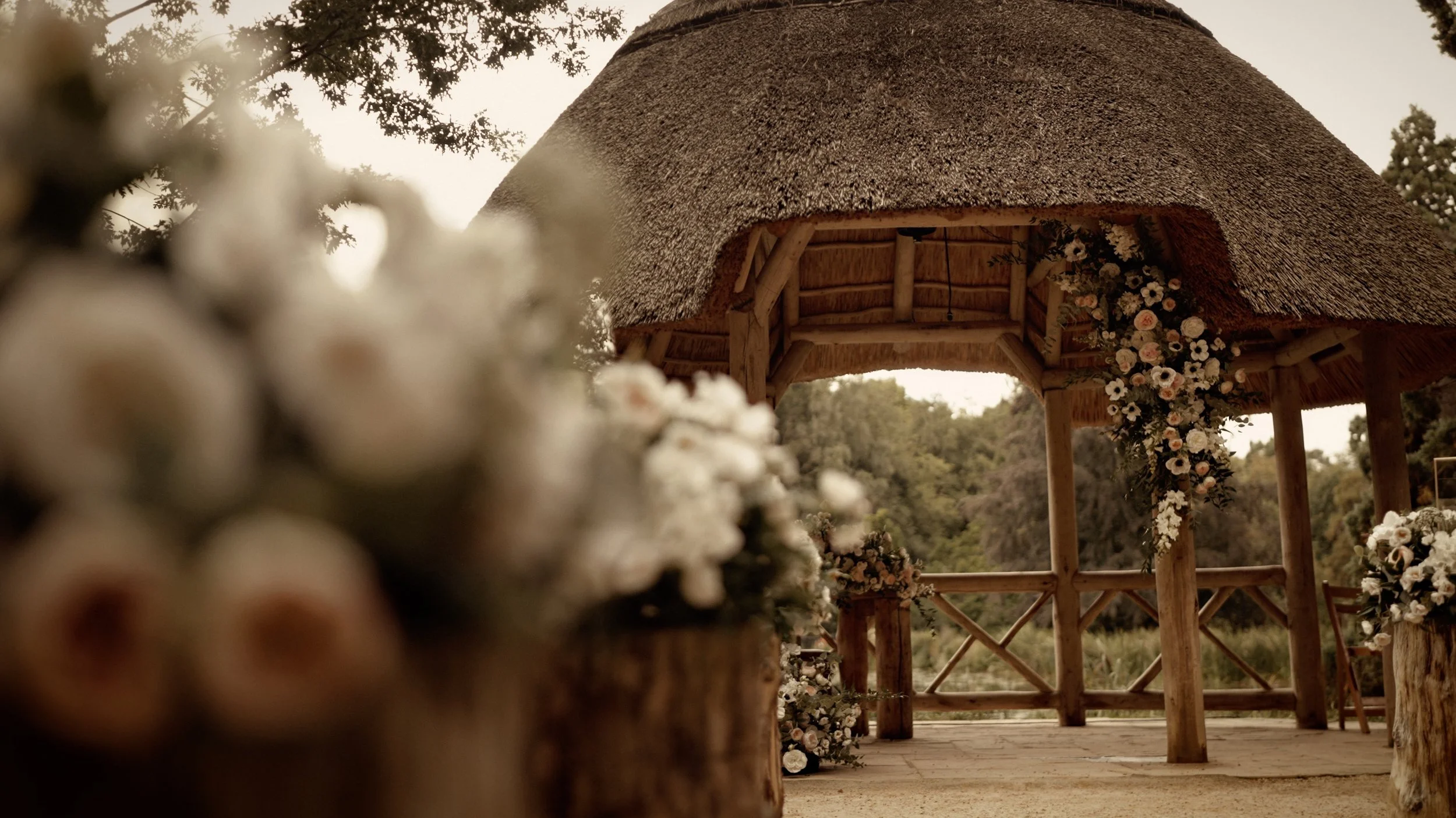 Wide shot of a lakeside ceremony at The Lapa at The Orangery Maidstone in Kent