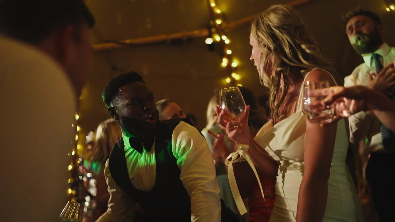 Candid moments from a colourful riverside wedding on the River Thames at an Oxfordshire country estate.