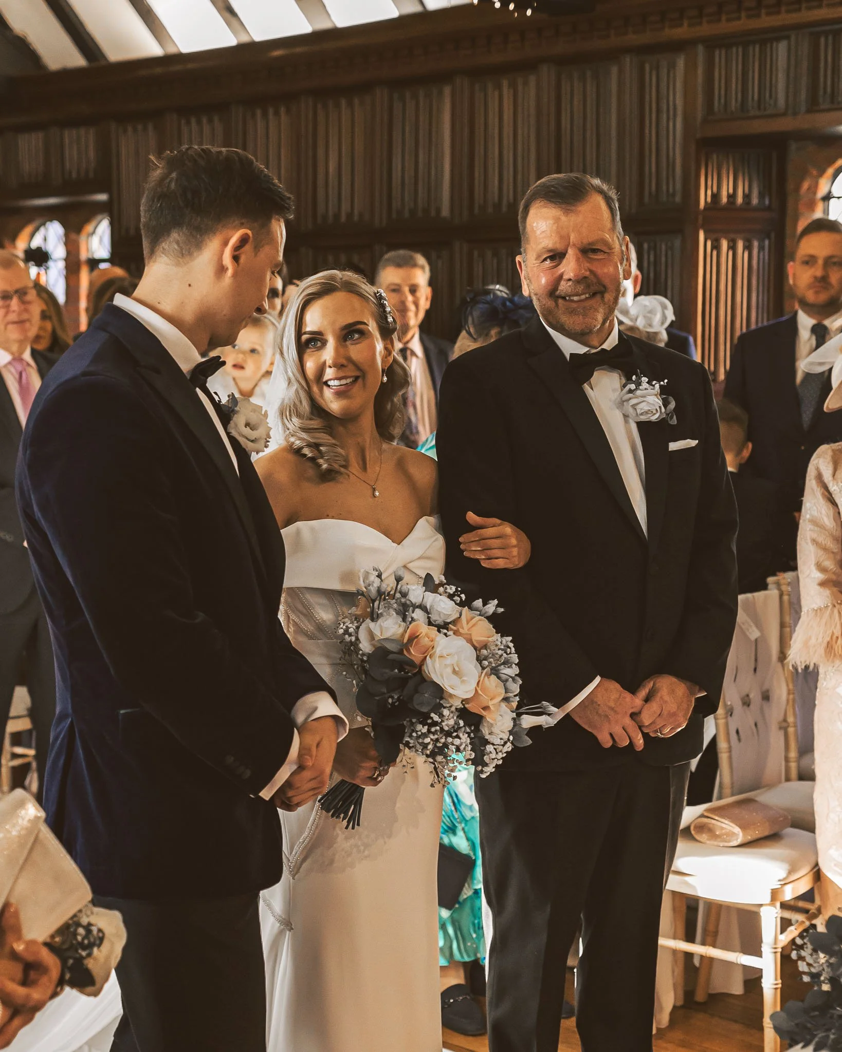 A wedding photography and videography team captures the moment a bride sees her husband at the ceremony, captured at Leez priory in Essex.