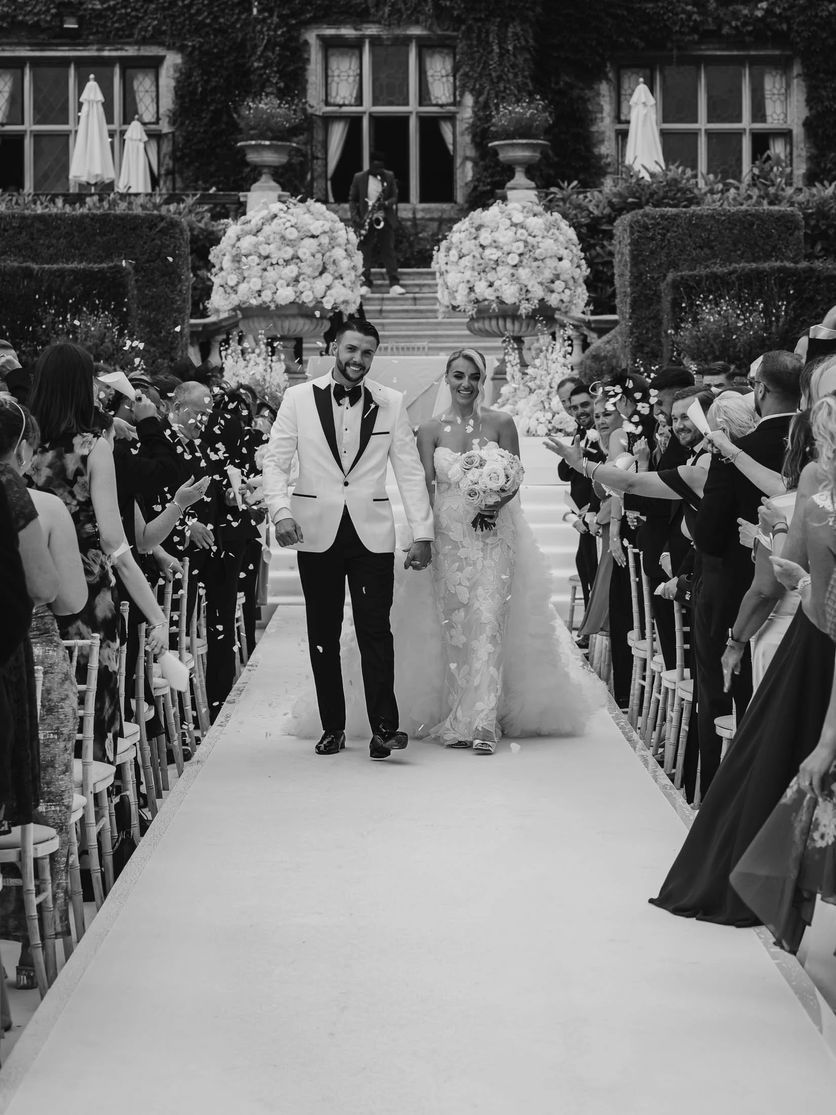 Confetti exit photographed and filmed for a cohesive wedding photo and film story