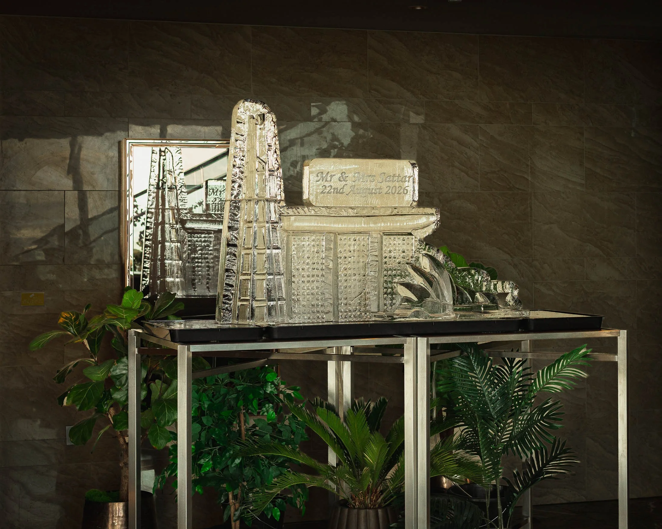 An ice sculpture sits in the entrance hall on the 34th floor of the Shard at the Shangri-La hotel as part of formal wedding decor for an international black tie wedding in London. The ice sculpture is shaped to show the Sydney Opera House, the Marina