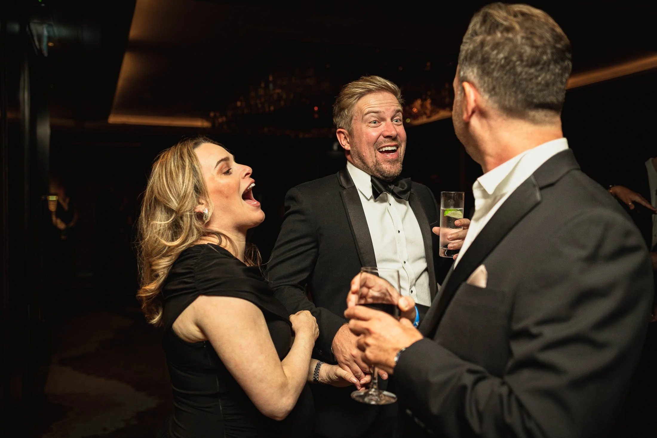 A candid wedding dance floor moment during evening celebrations of a black tie wedding in London.
