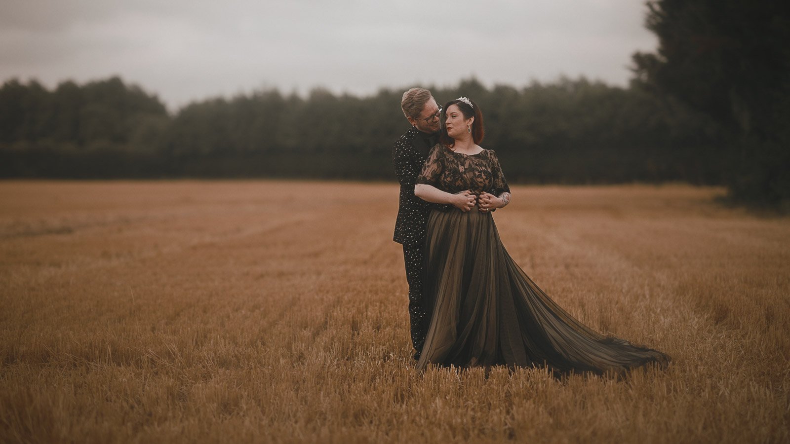 Golden hour portraits at an alternative wedding featuring a gothic bride and groom, captured for a Winters Barns wedding film.