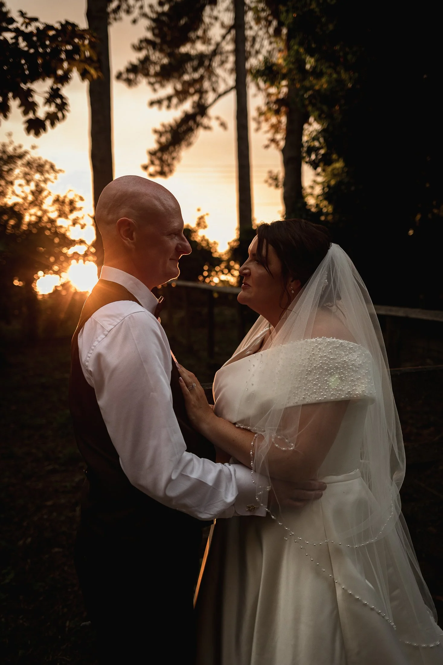 Golden hour portrait with a sun flare at Port Lympne Hotel wedding.