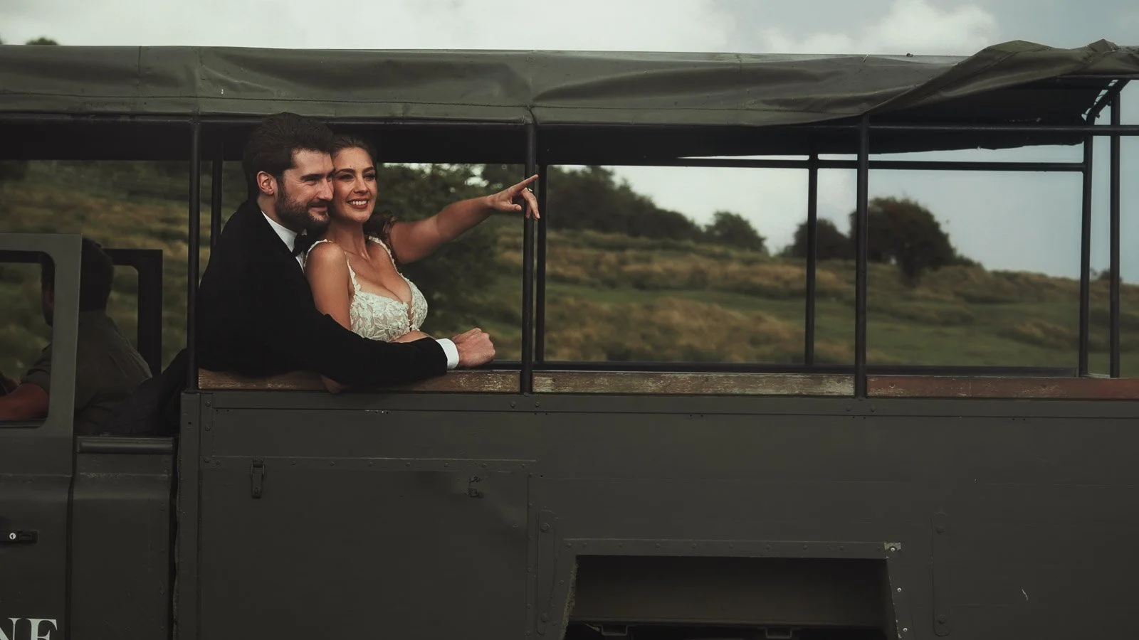 A couple point and look at wildlife during a safari in Kent.