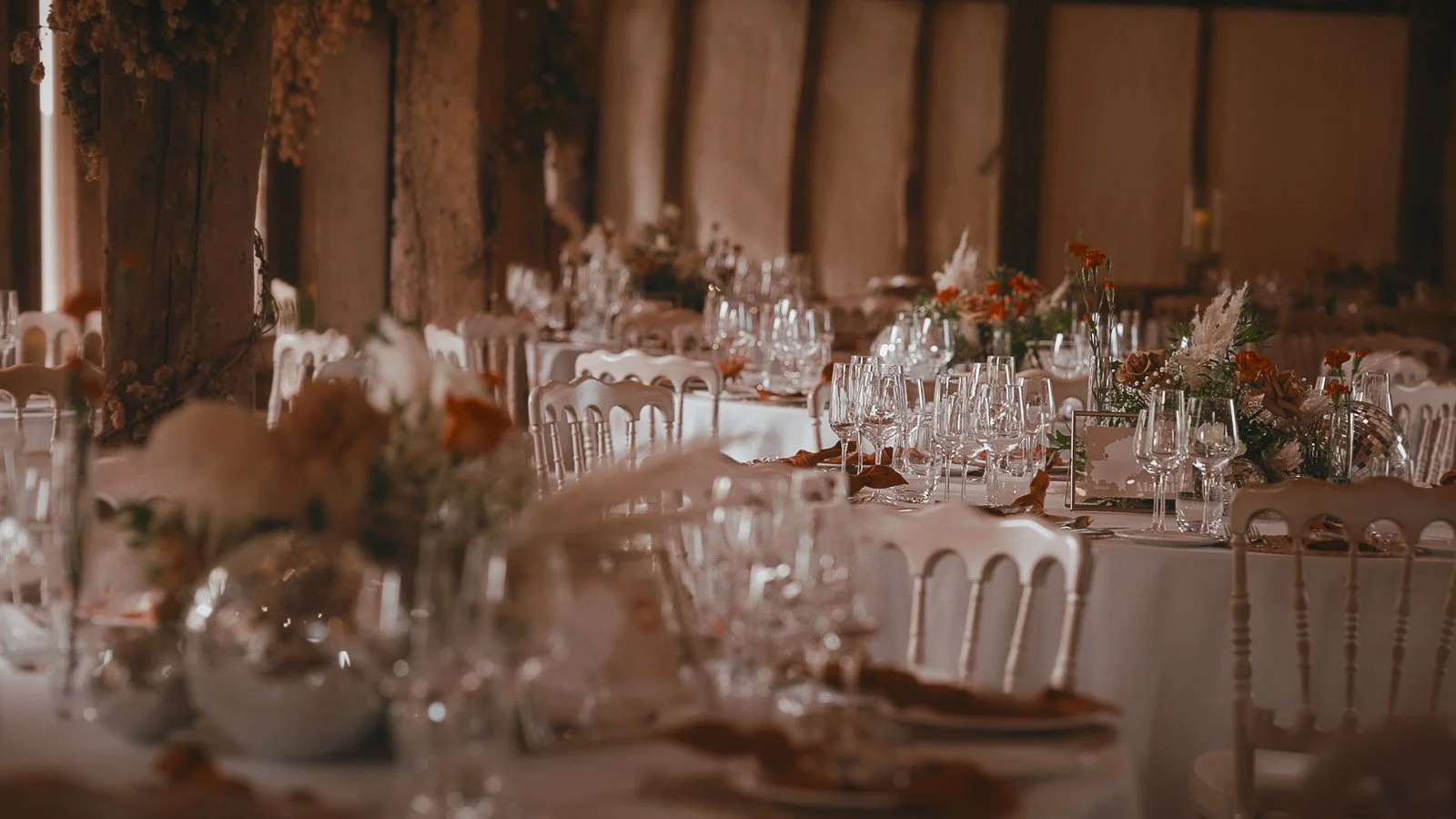 Floral installation with pampas grass and disco balls, styled for a vibrant Winters Barns reception.