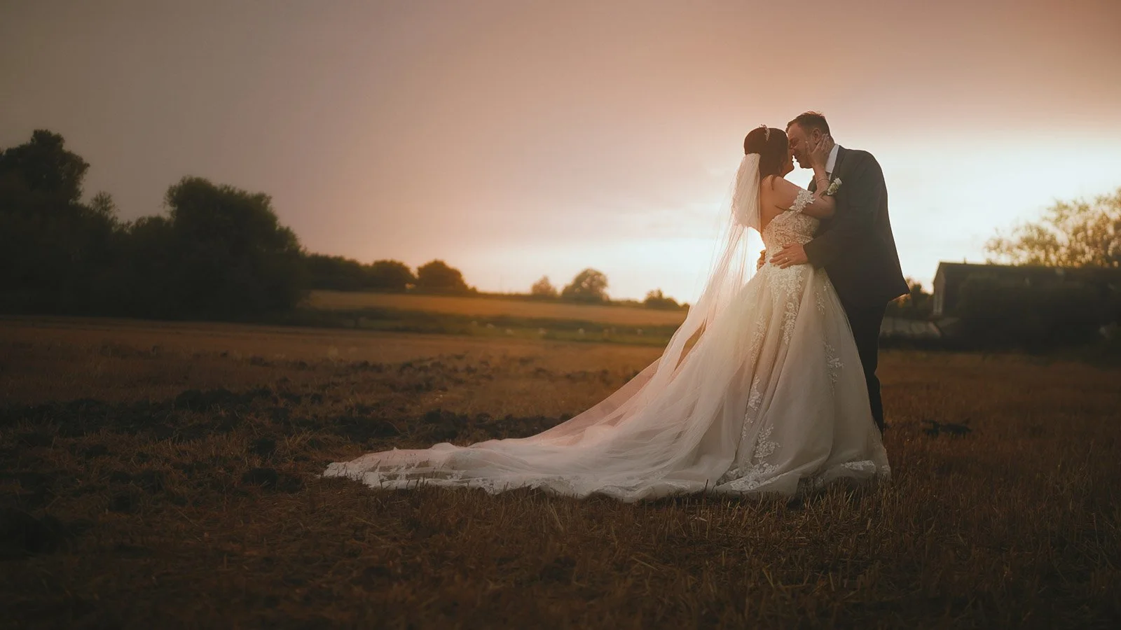 Late evening golden hour portraits filmed near Cooling Castle Barn wedding venue at sunset.