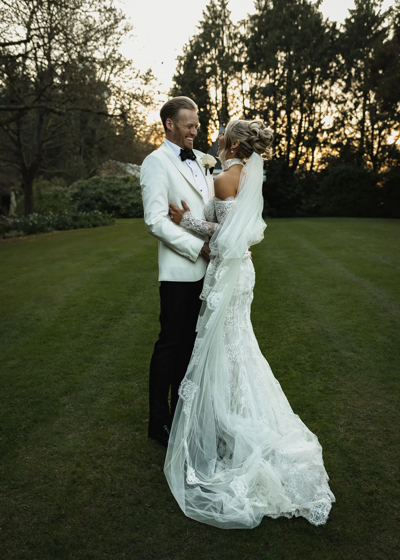 White tuxedo groom and bride during golden hour at The Orangery Maidstone in Kent.