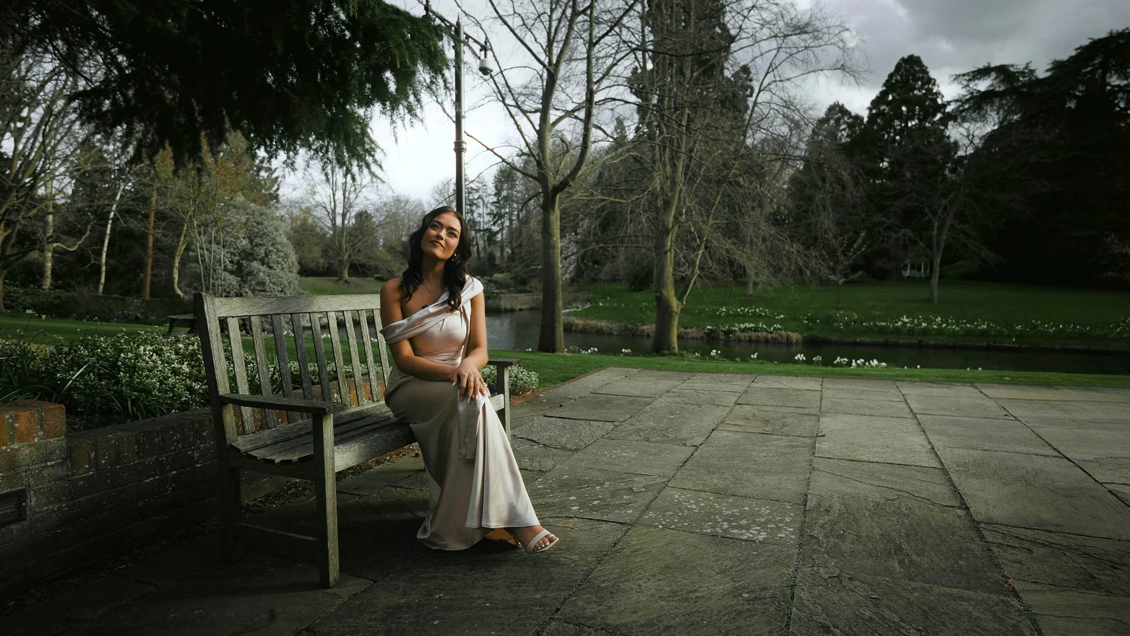 A shot from a storytelling wedding film captured in the UK, as the sister of the groom gives an interview to camera, providing personal and emotive narrative for the film.