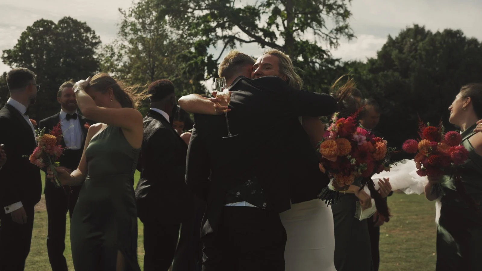 Guests and atmosphere from a colourful riverside wedding with black-tie styling and a marquee party on the Thames.