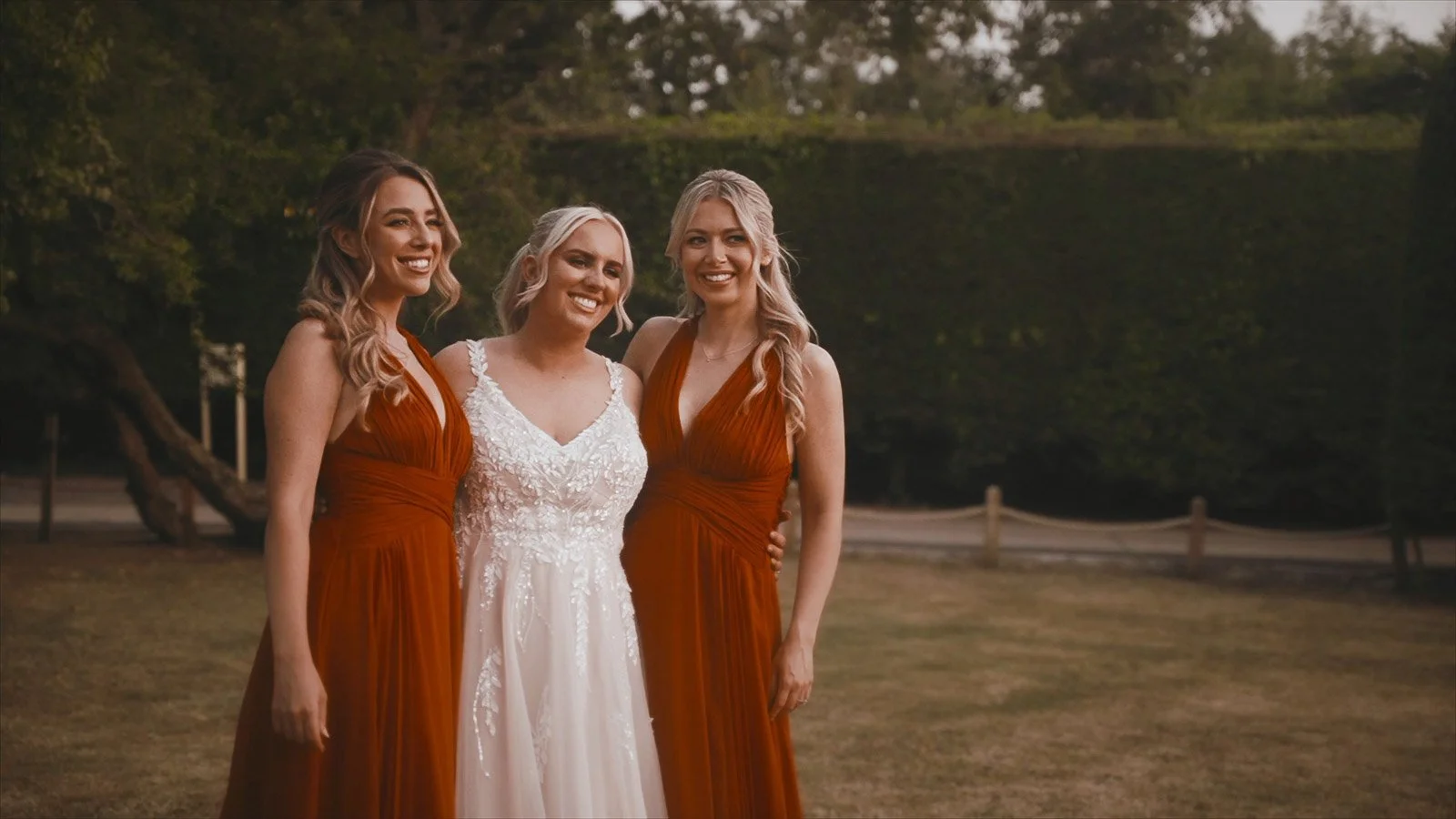Bride and bridesmaids laughing during portraits outside Winters Barns, captured with a relaxed, natural approach.
