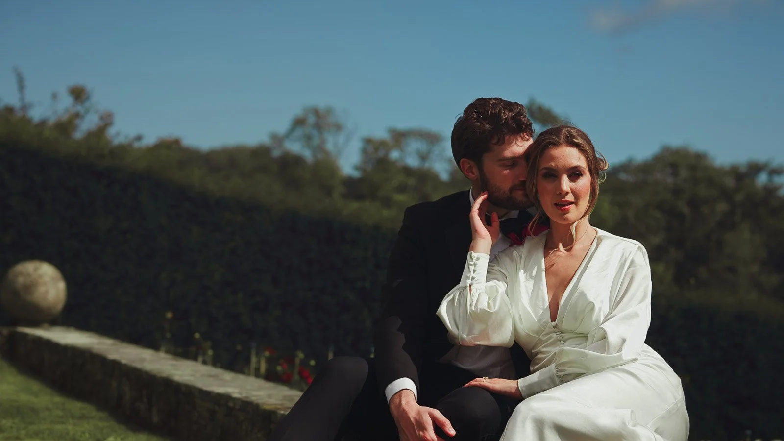A fashion-forward, editorial style moment as a bride and groom pose for their wedding film.