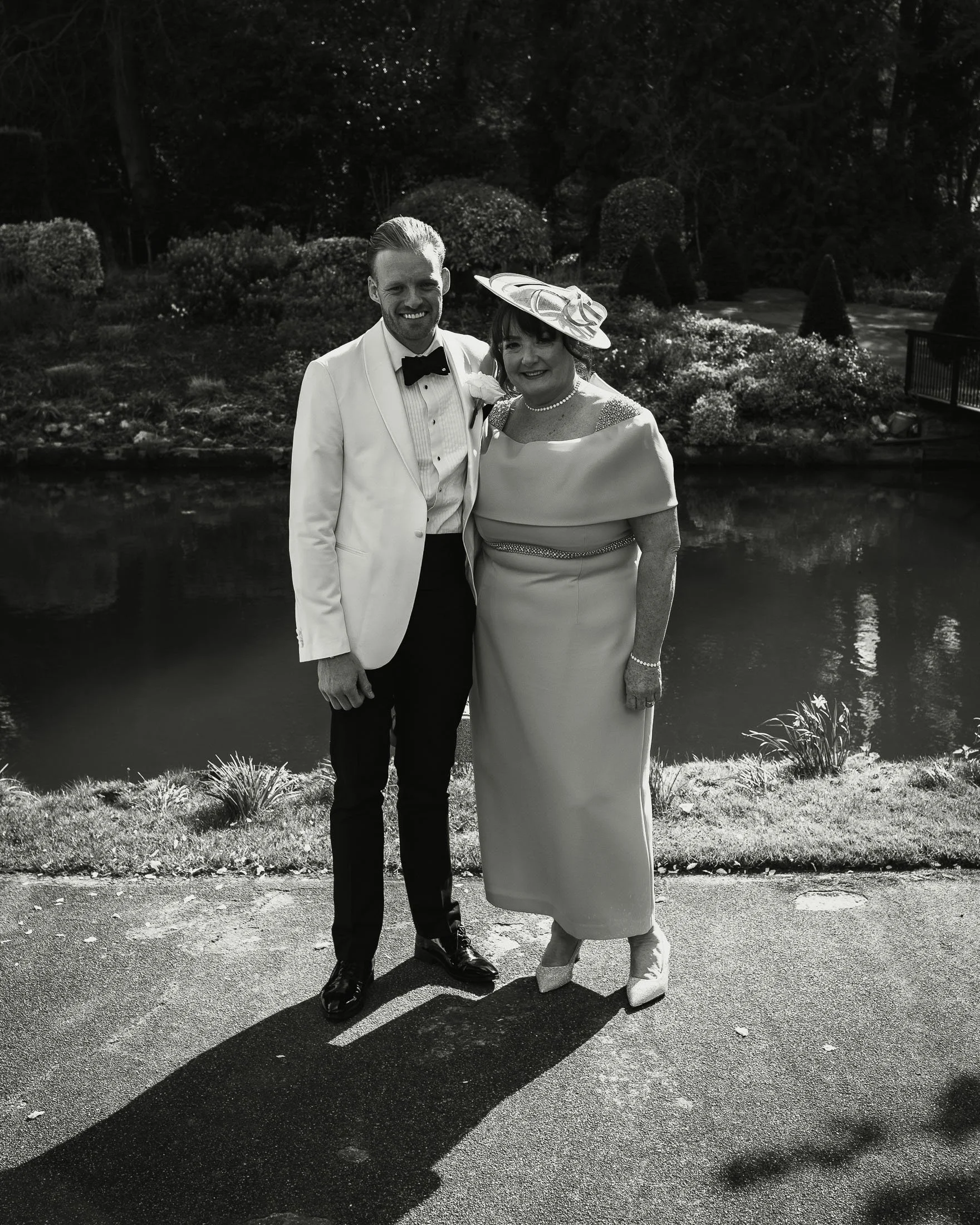 Candid wedding photography and videography at The Orangery Maidstone with a groom and his mother.