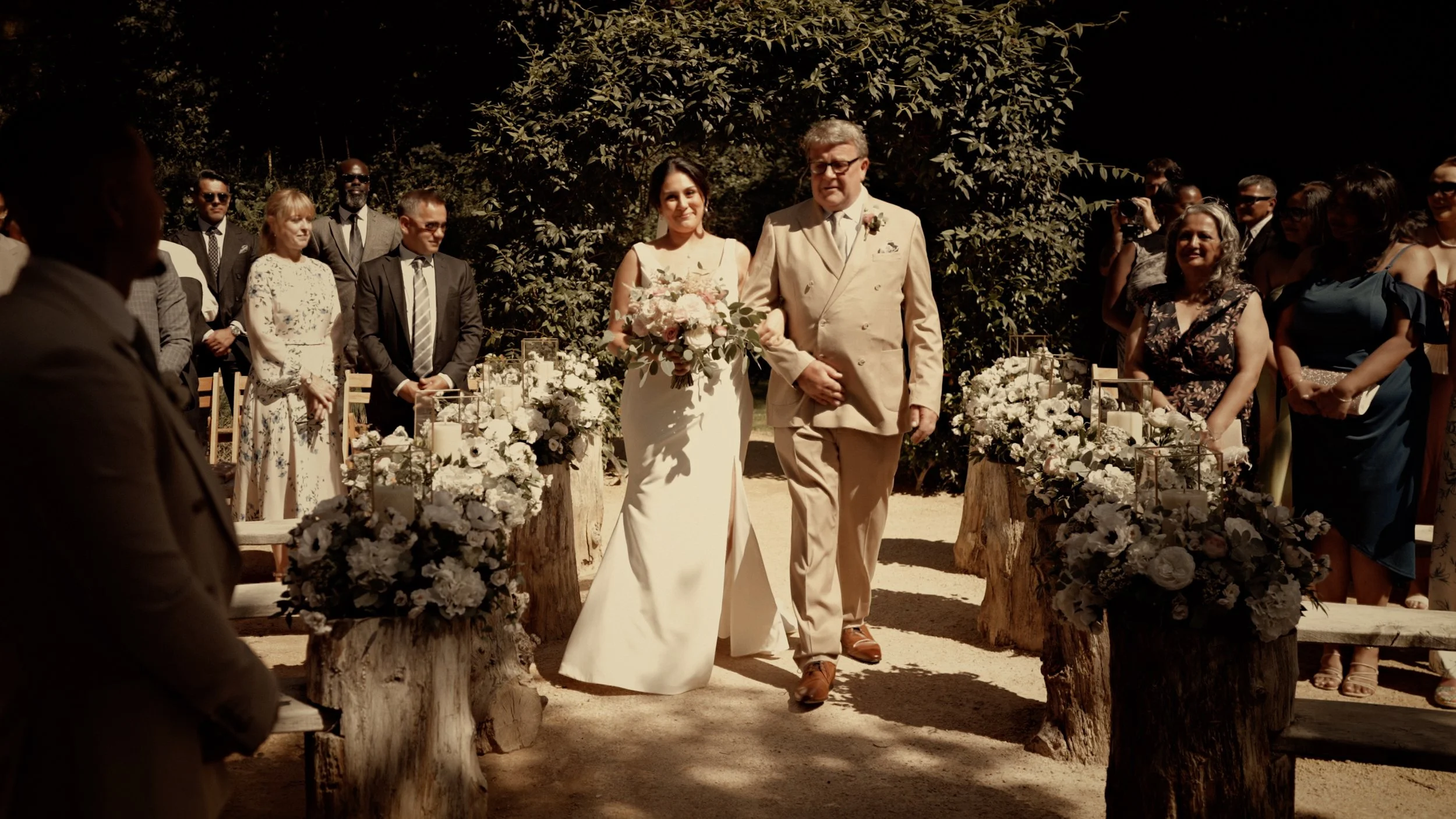 A bride walks down the aisle at The Lapa at The Orangery Maidstone