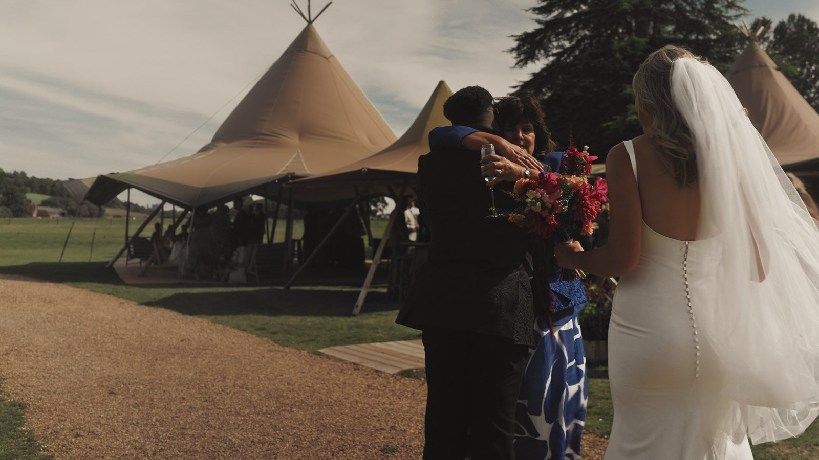 Candid moments from a colourful riverside wedding on the River Thames at an Oxfordshire country estate.