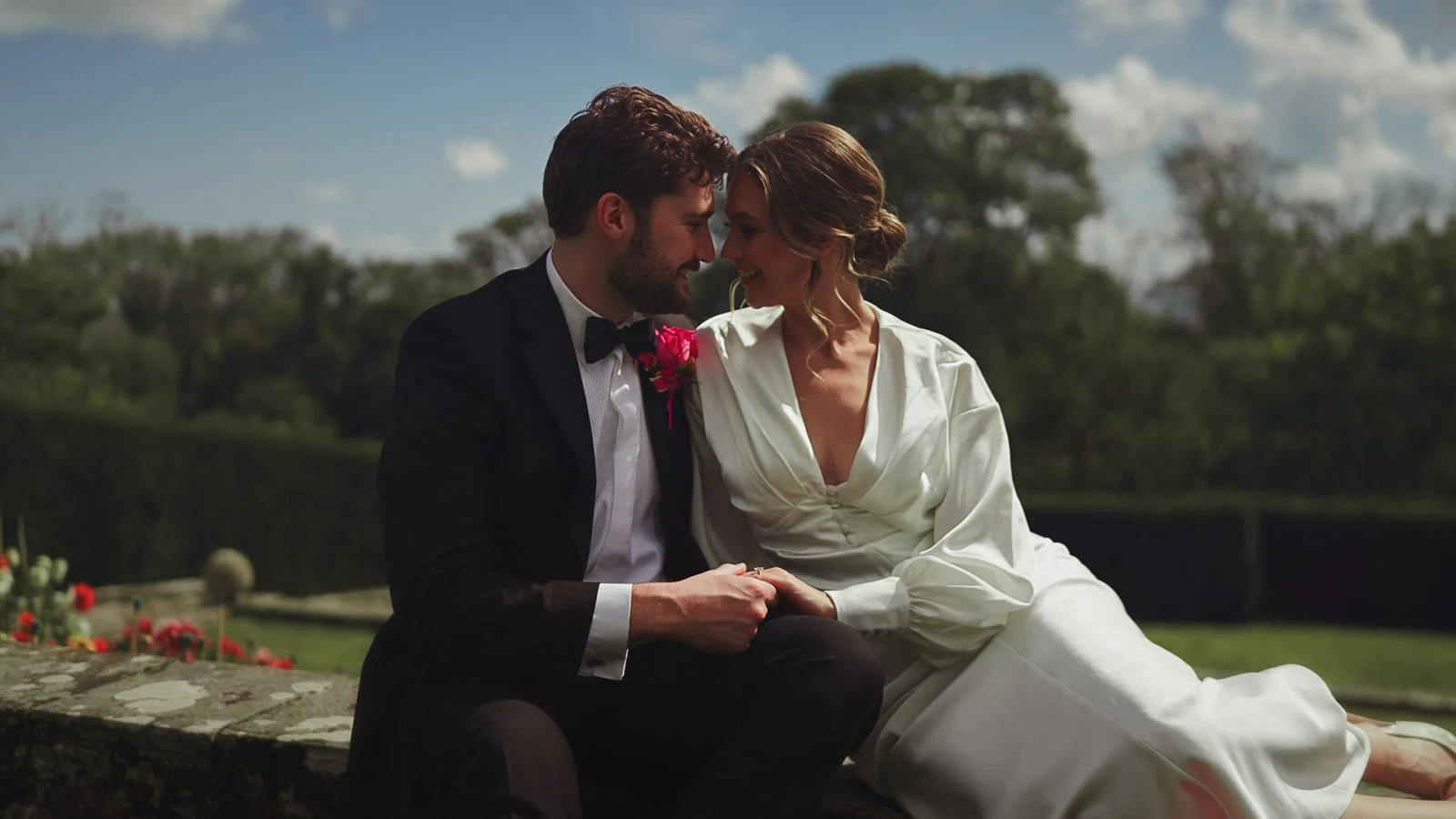 Editorial wedding portrait with vivid florals and refined composition