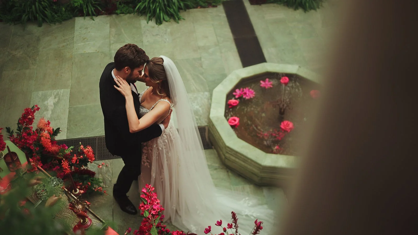 Intimate courtyard moments during a first dance at a colourful editorial wedding in Kent.