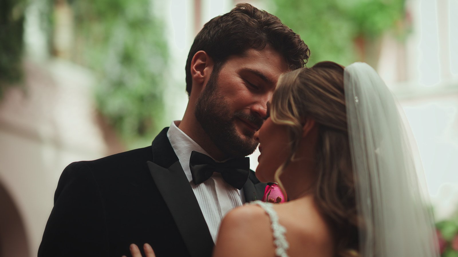Groom portrait in black tie with soft shadows and refined tone