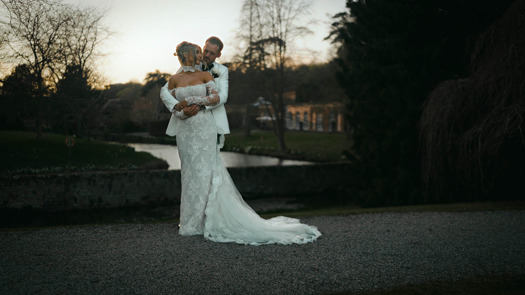 A sunset golden hour portrait of a couple during their black-tie wedding at The Orangery, UK, as a part of their storytelling wedding film.
