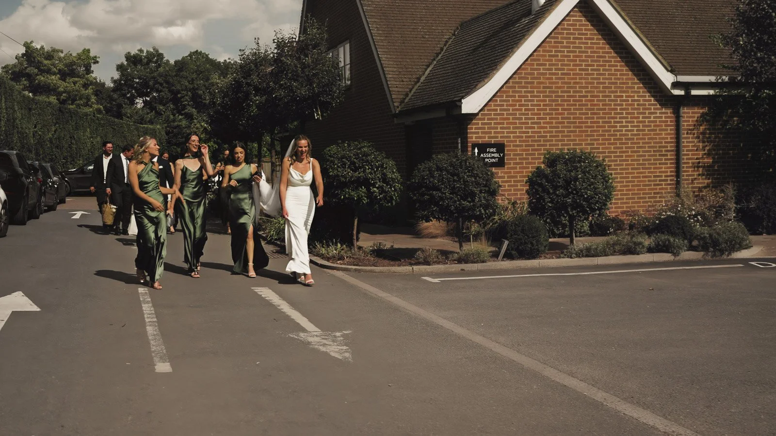 Editorial-style wedding photography from a colourful riverside celebration with bold florals and a marquee reception.