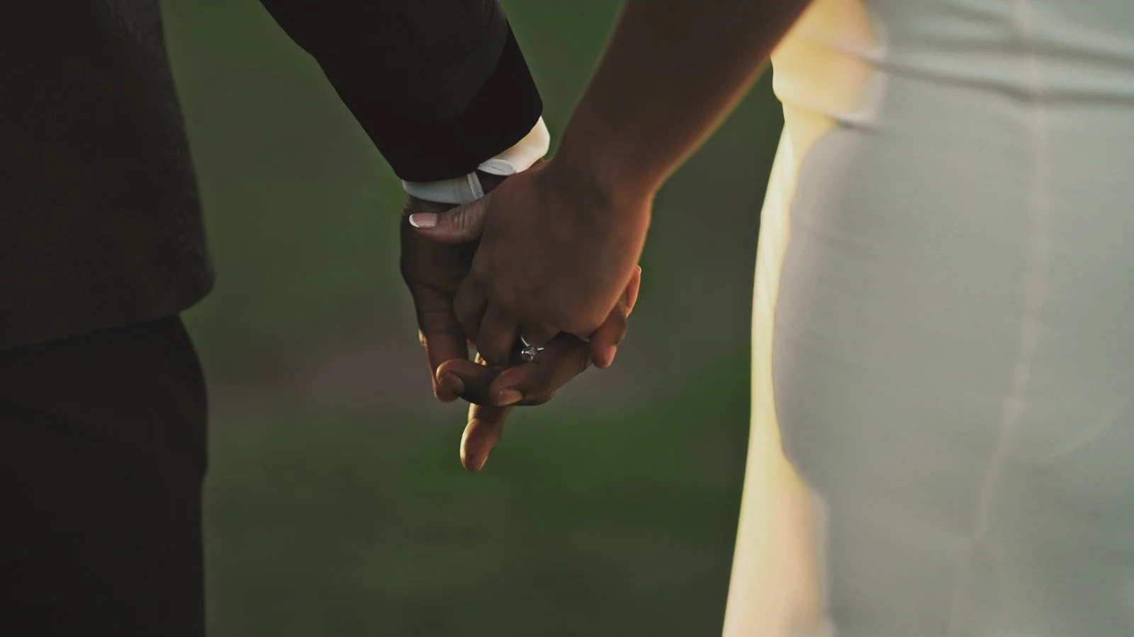 Editorial-style wedding photography from a colourful riverside celebration with bold florals and a marquee reception.