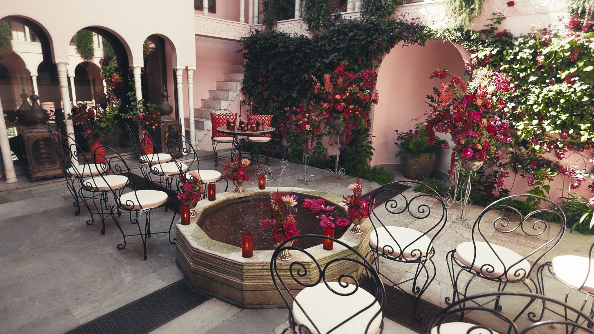 A luxurious pink-themed wedding decor setup in the Moroccan Courtyard at Port Lympne Hotel & Reserve
