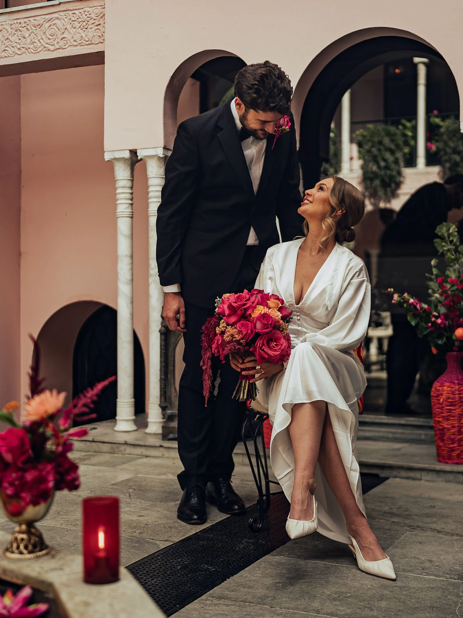 A couple pose for portraits during their black-tie wedding day for an emotional moment in their cinematic wedding film.