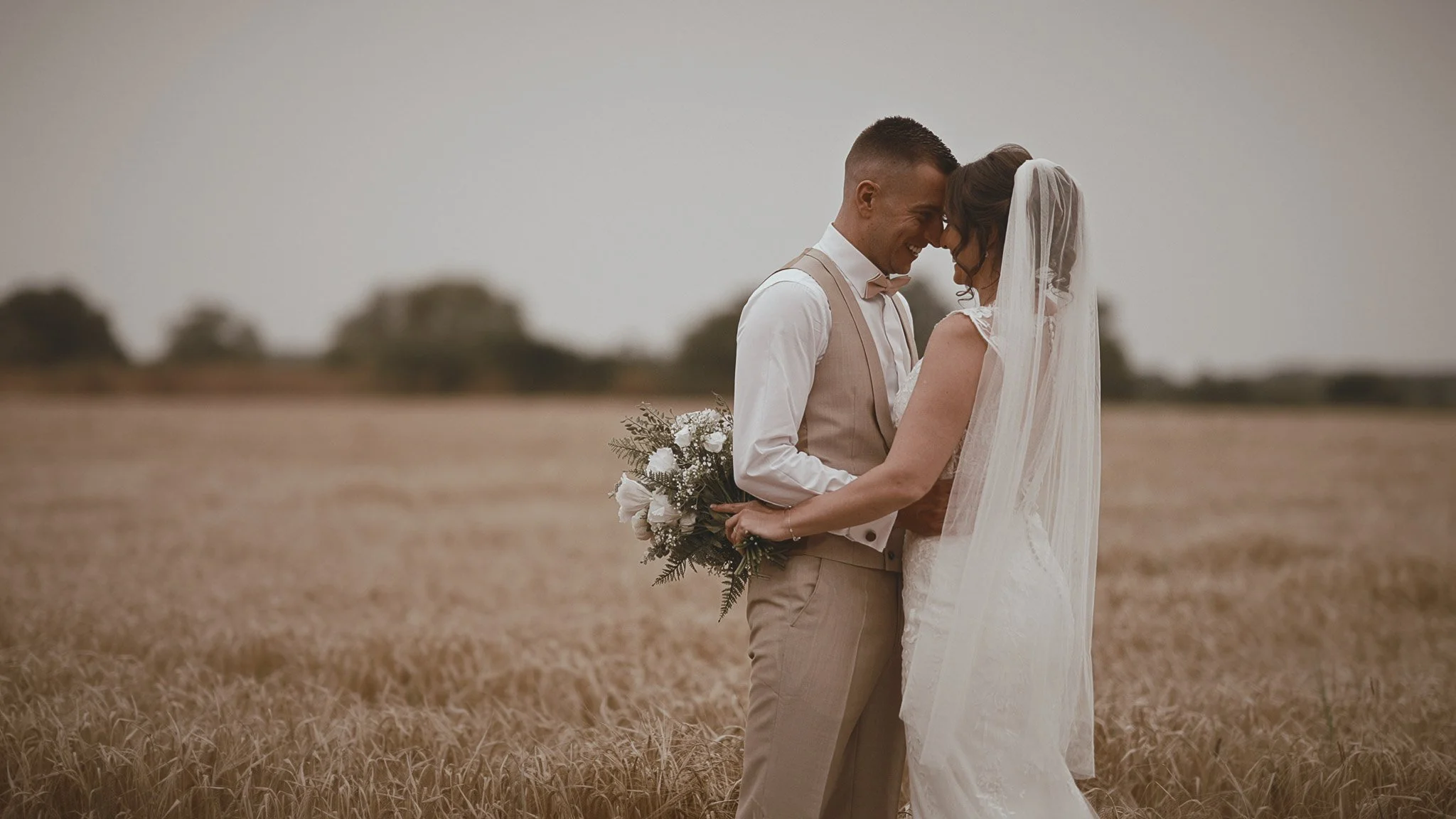 Couple portrait at Vaulty Manor with countryside backdrop in Essex