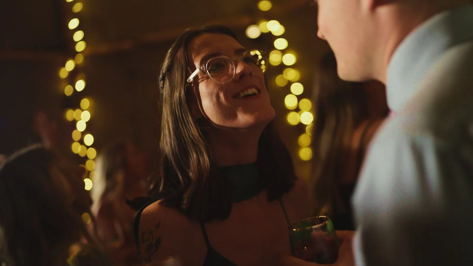 Guests and atmosphere from a colourful riverside wedding with black-tie styling and a marquee party on the Thames.