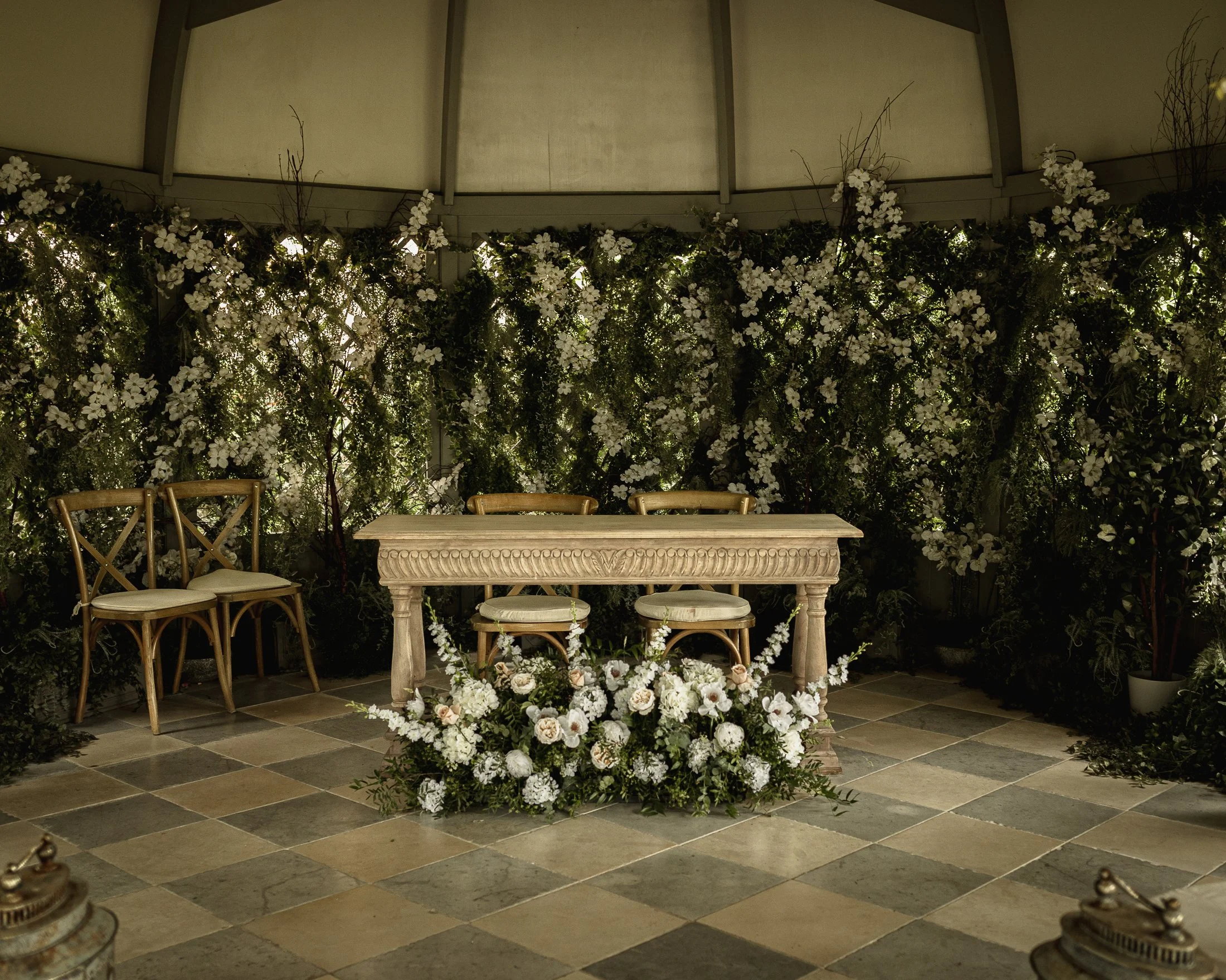 The ceremony table and flower decorations at Port Lympne Hotel wedding venue.