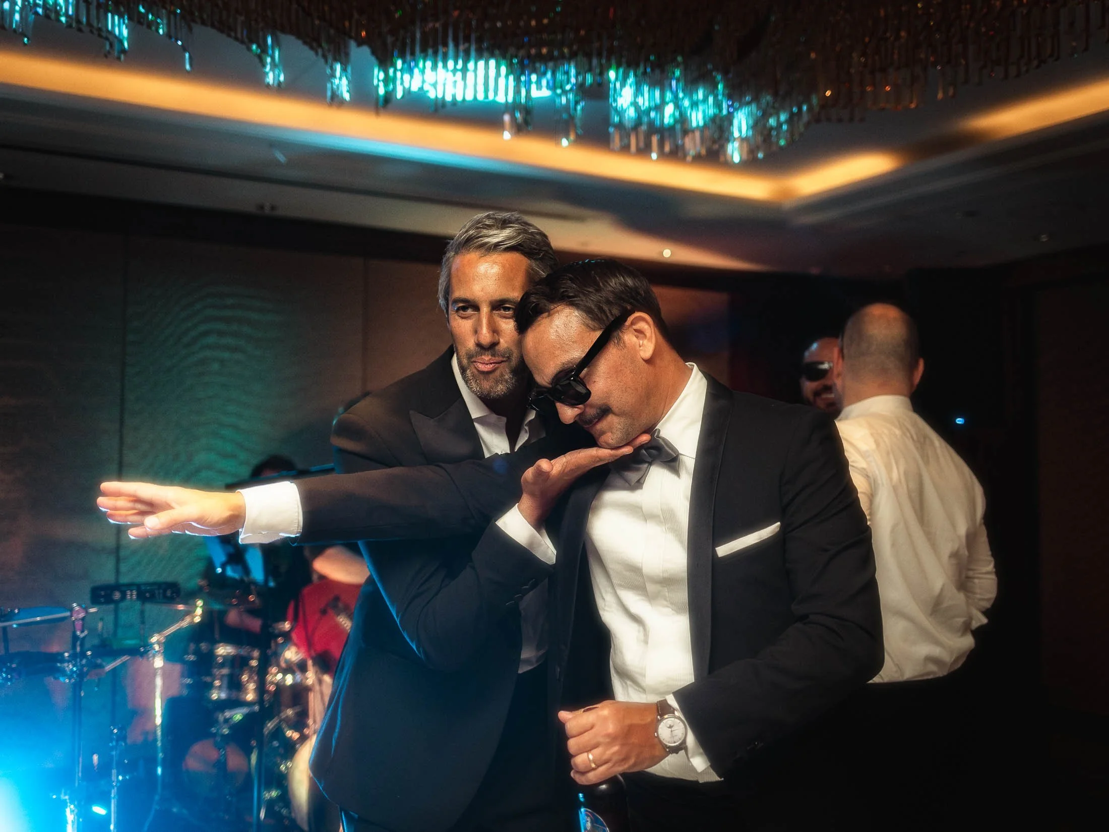 Guests at a luxury black tie London wedding at The Shard dance during evening celebrations.