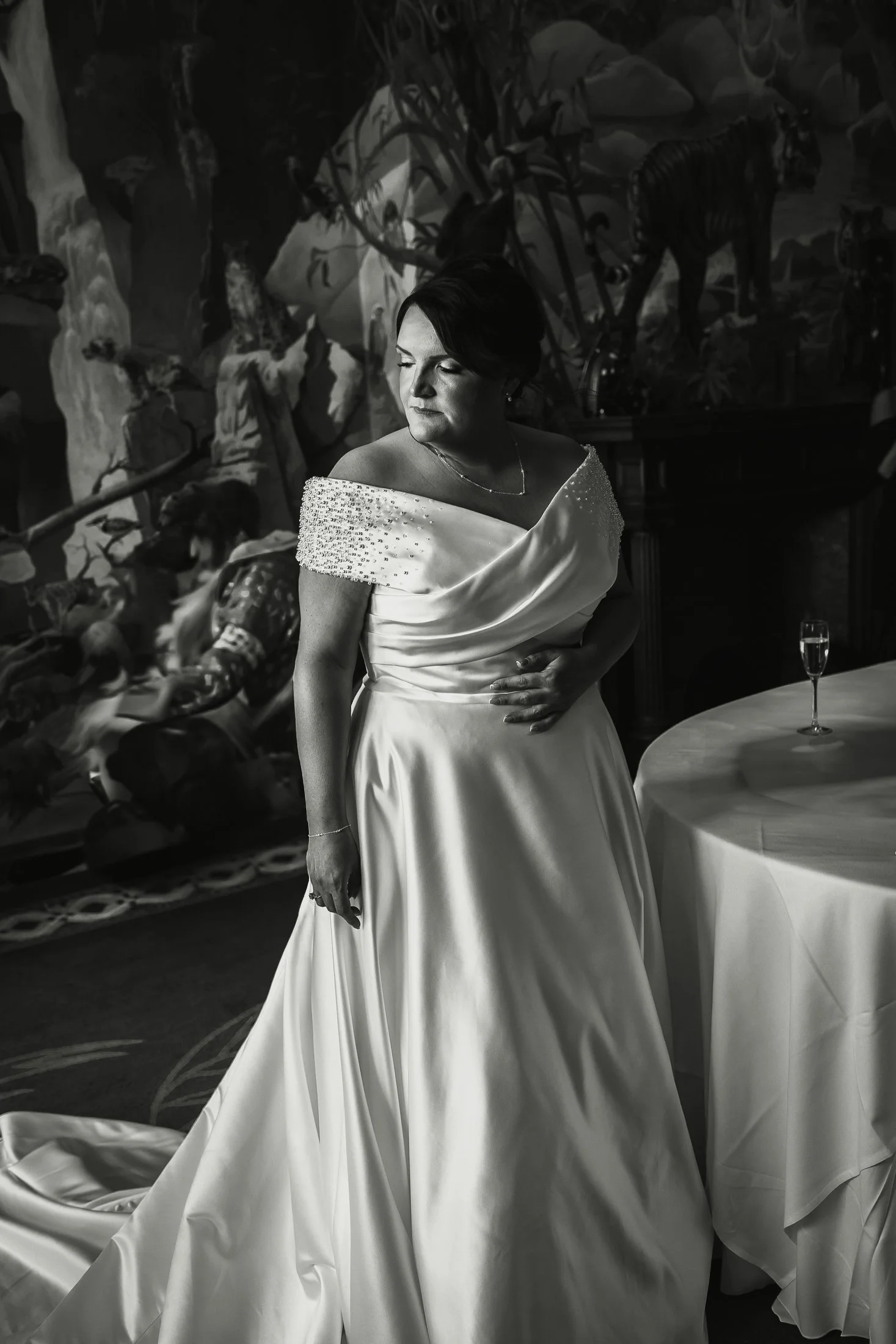 An editorial black and white bridal portrait of Lucy on her wedding morning at Port Lympne Hotel & Reserve.