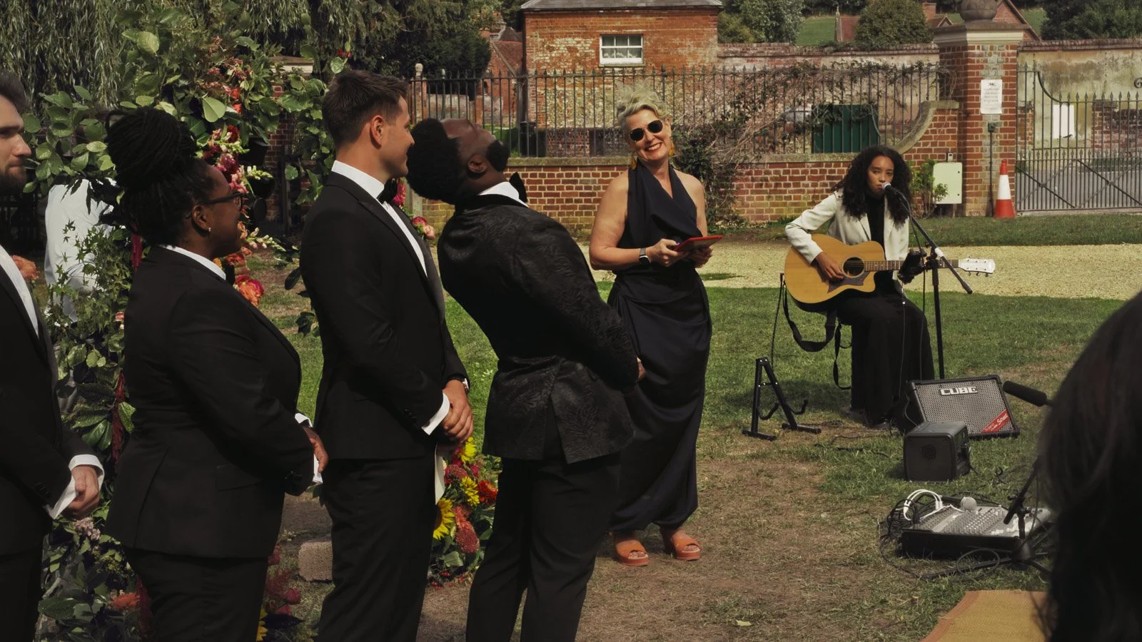 Candid moments from a colourful riverside wedding on the River Thames at an Oxfordshire country estate.