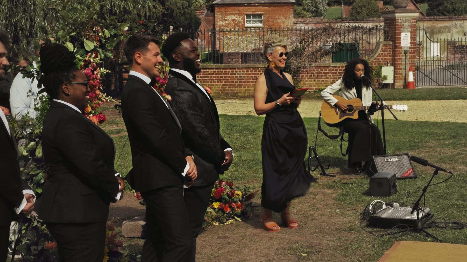 Candid moments from a colourful riverside wedding on the River Thames at an Oxfordshire country estate.
