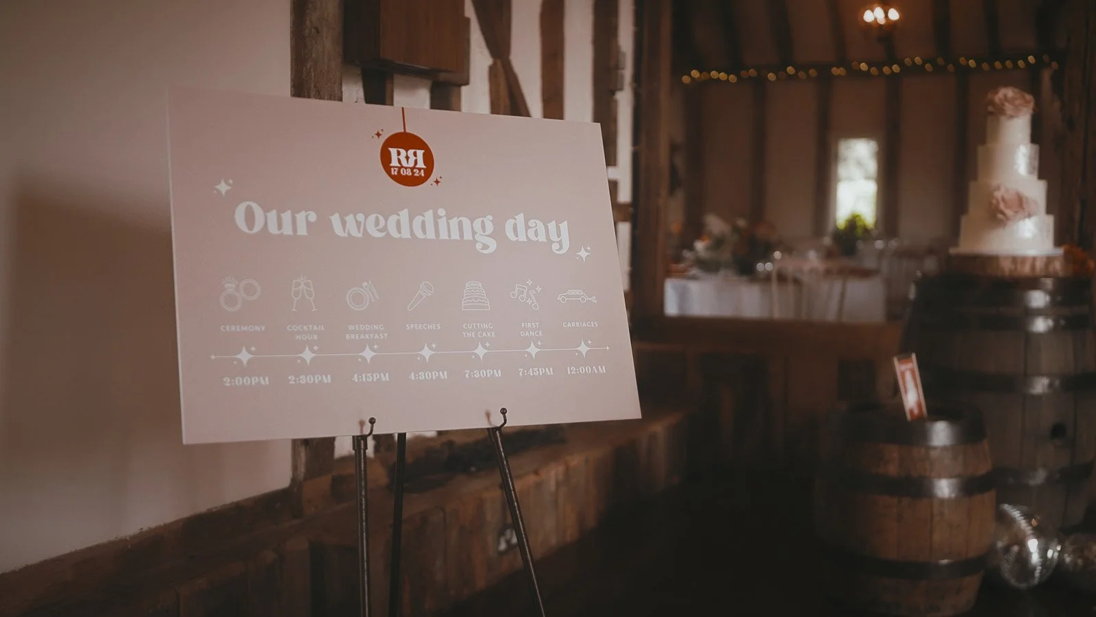 A pink welcome sign sits in the main barn at Winters Barns, Kent.