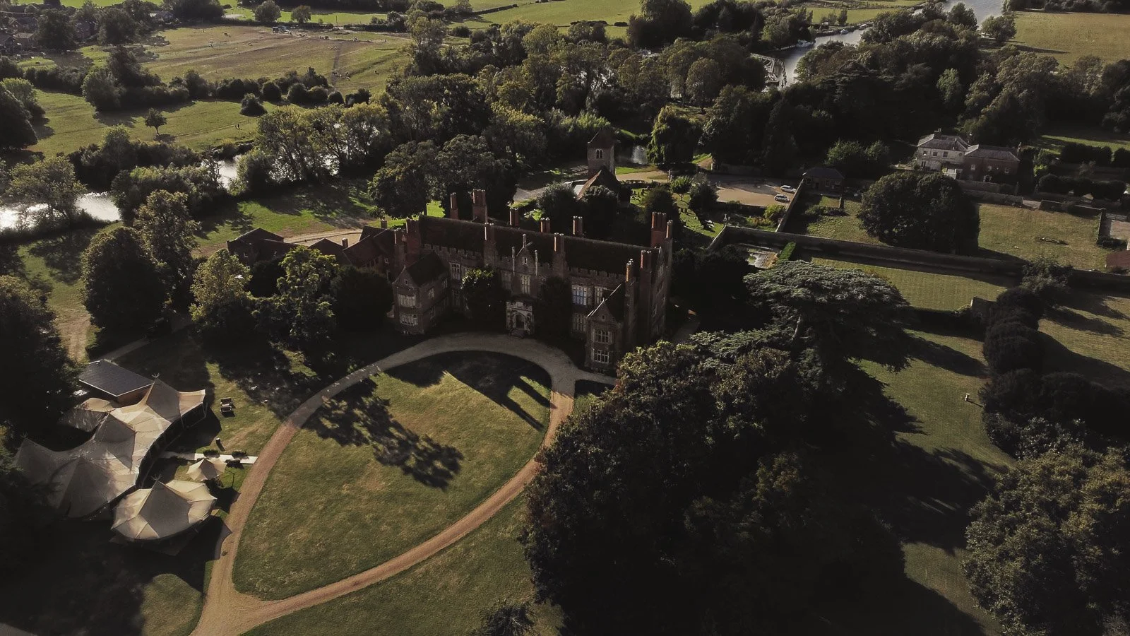 Guests and atmosphere from a colourful riverside wedding with black-tie styling and a marquee party on the Thames.